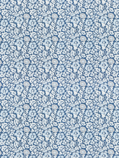 Blue fabric with white damask floral scroll pattern; ornate, repeating motif suitable for upholstery or apparel.