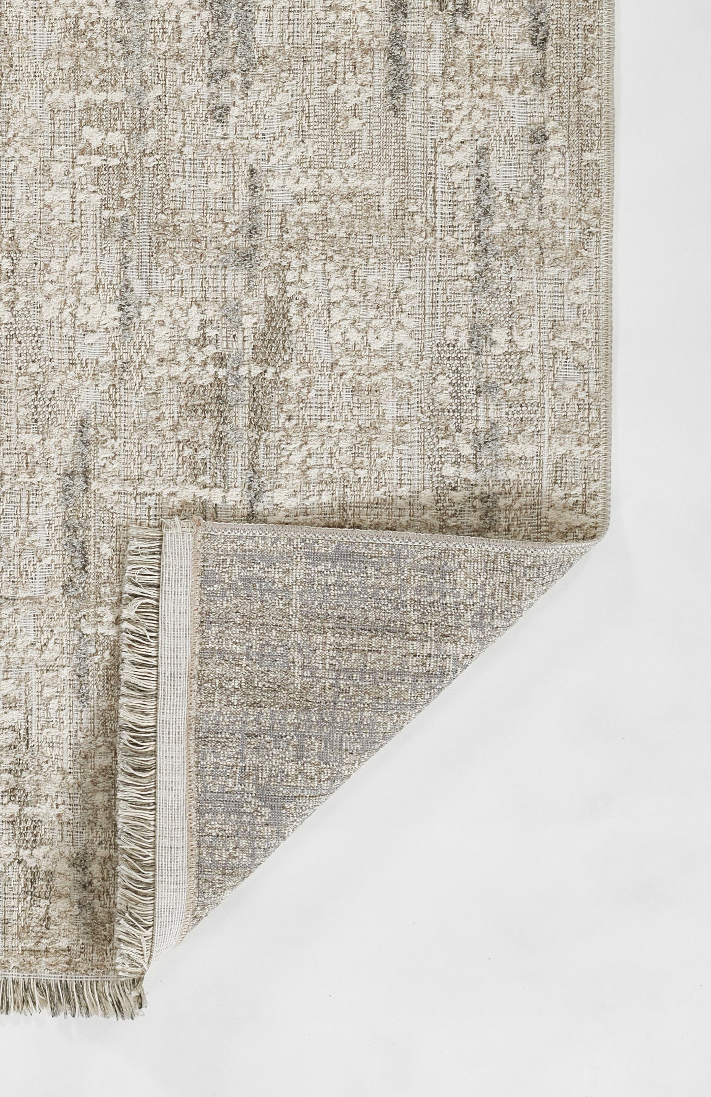 Gray distressed-pattern area rug with beige tones and fringe on the ends.