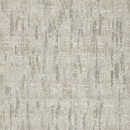 Rectangular area rug in gray & beige with distressed abstract geometric pattern; soft textured weave.