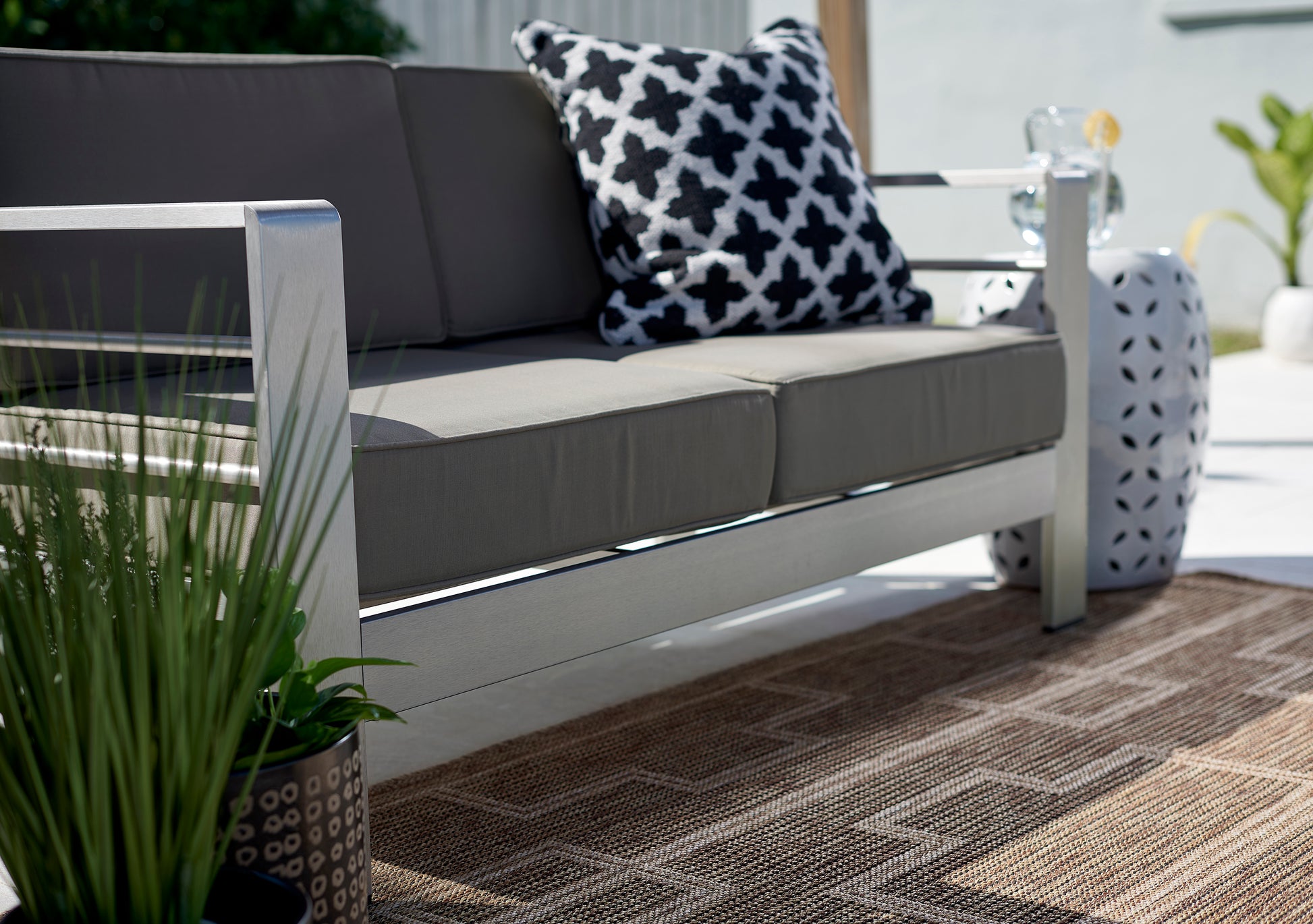 Outdoor 3' x 8' runner rug in brown tones.