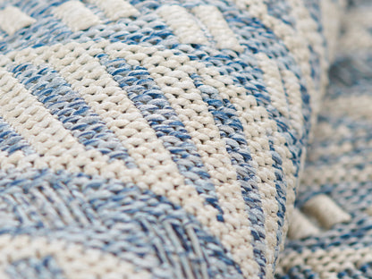 Blue and cream chunky woven rug with striped pattern; handwoven.