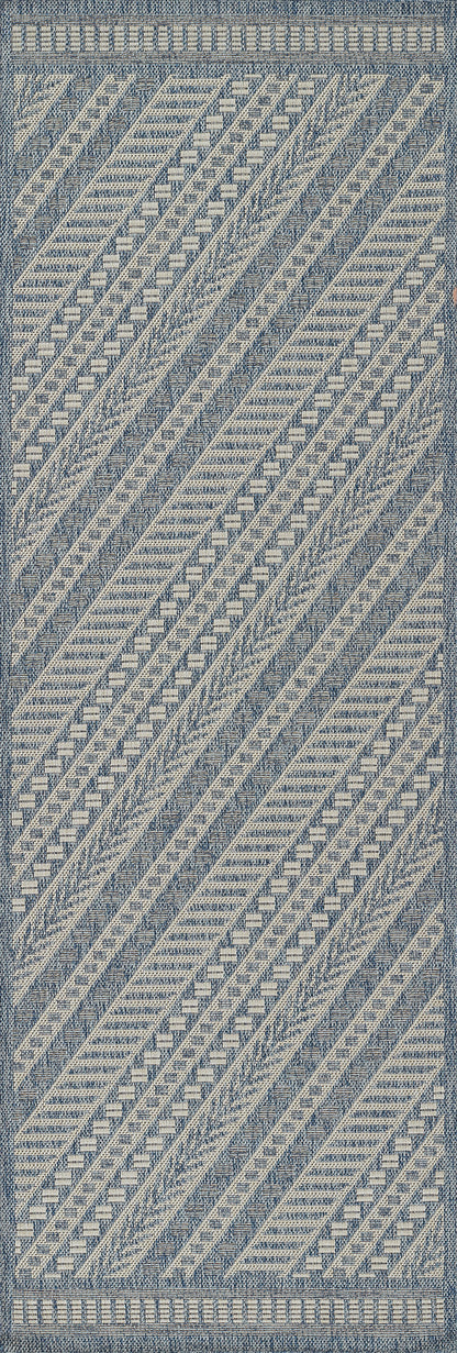 Blue and ivory woven rug with diagonal geometric bands, chevron and diamond motifs, bordered edge.