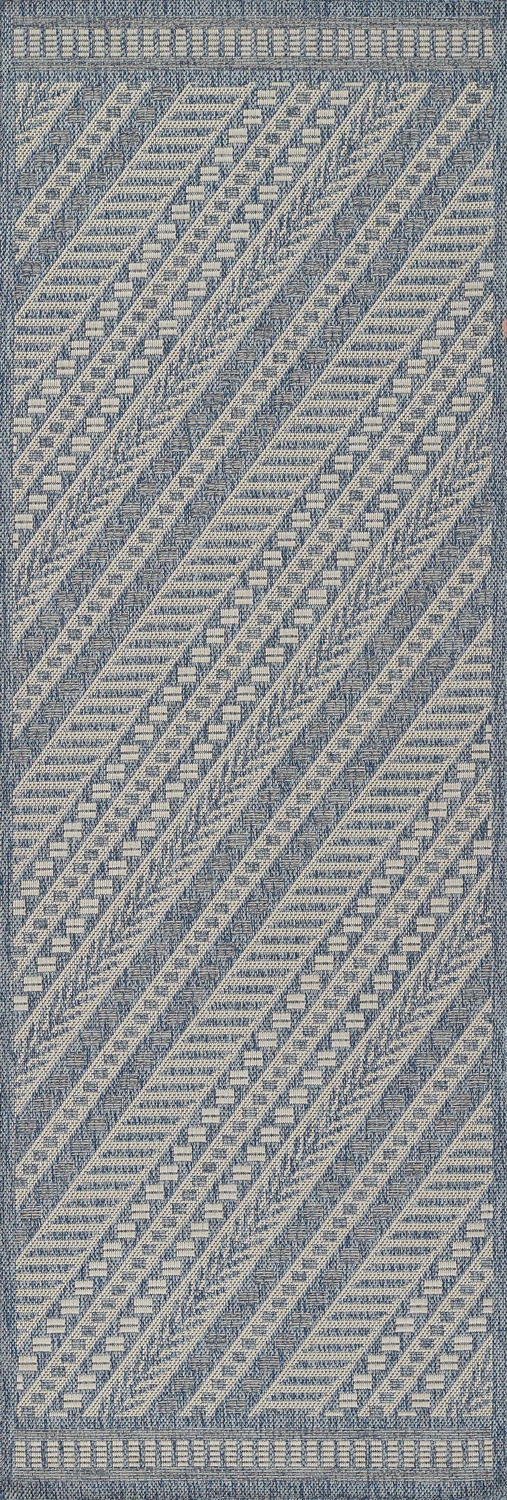Blue and cream woven rug with diagonal geometric stripes and textured border.