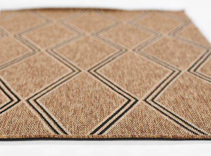 Rectangular natural tan woven rug with diamond grid pattern in double charcoal lines; textured jute surface.