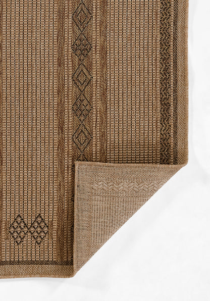 Natural brown jute rug with geometric diamond border, textured weave, folded corner.
