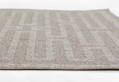 Neutral gray and beige geometric patterned area rug with rectangular motifs and low-pile woven texture.