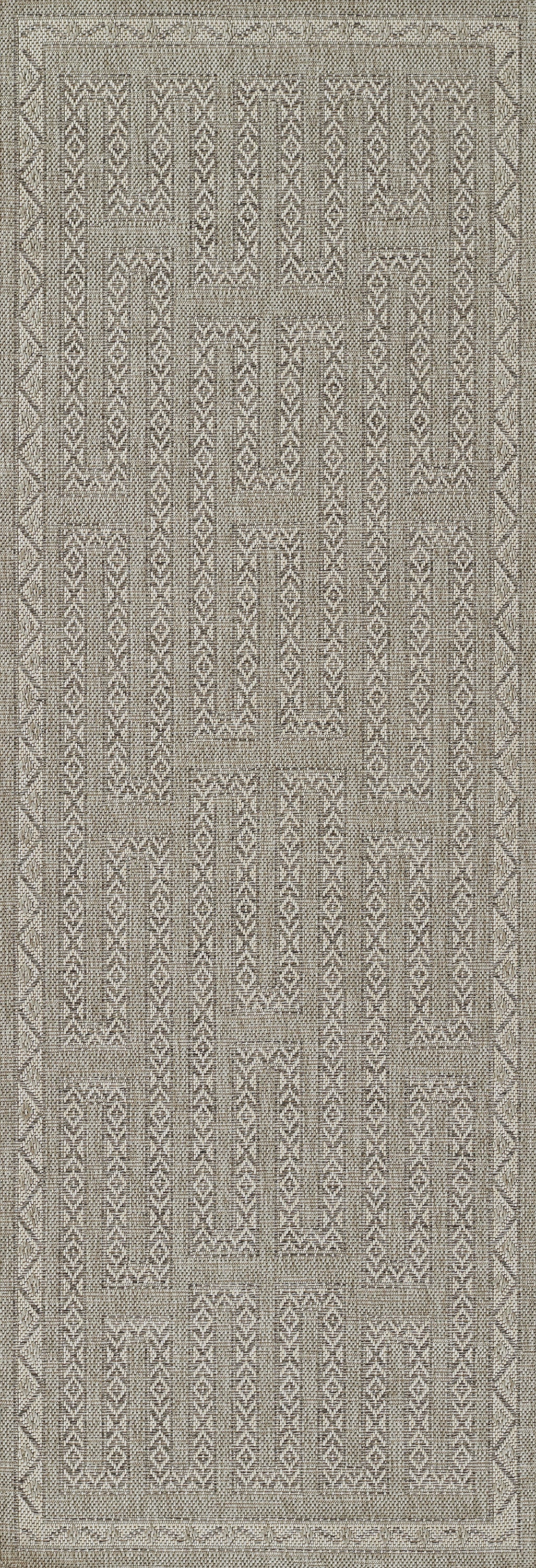 Gray geometric flat-weave rug with patchwork blocks and tribal motifs, bordered for a rustic-modern vibe.