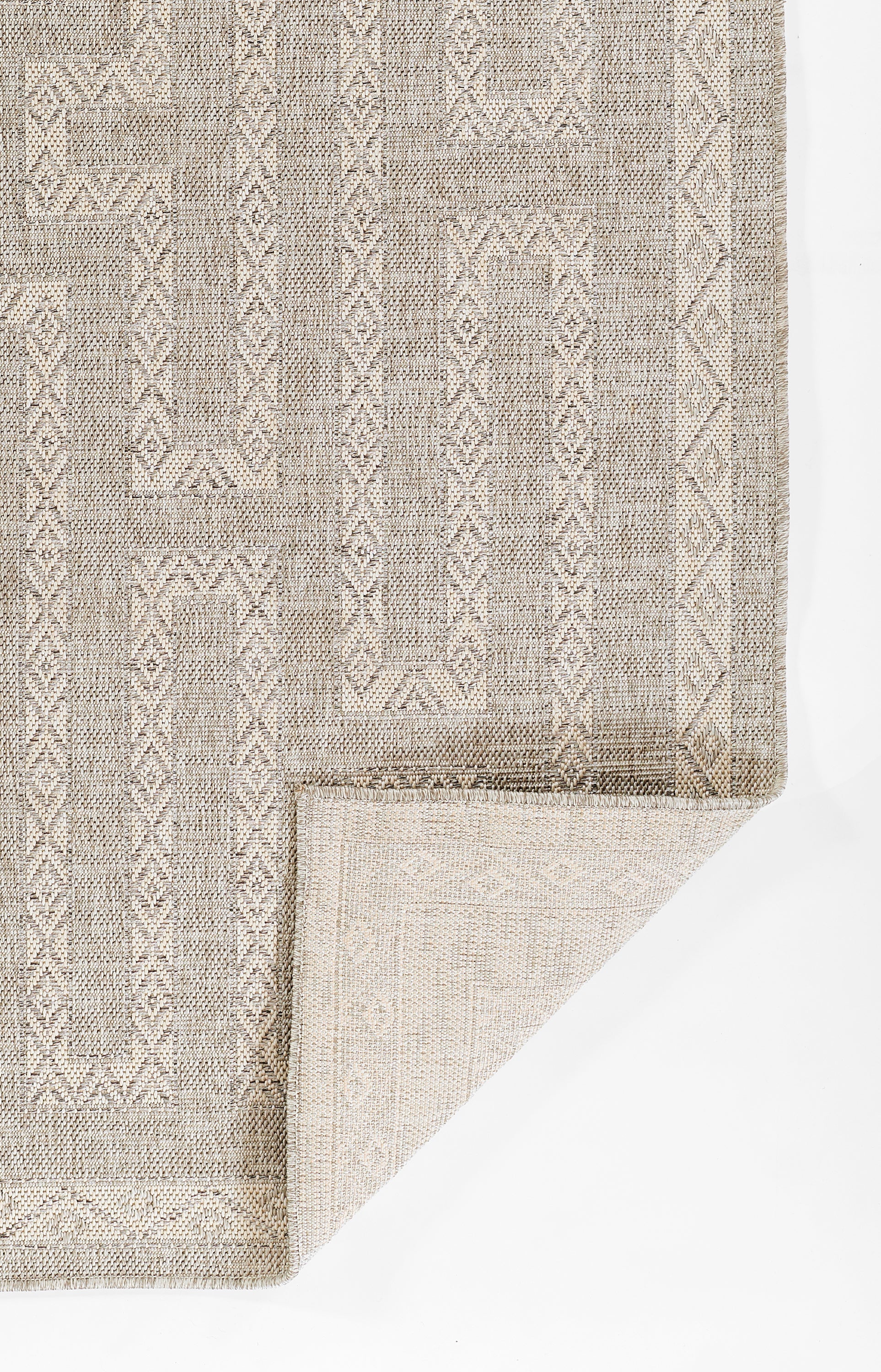 Neutral gray-beige geometric flatwoven area rug with diamond motifs and subtle borders.