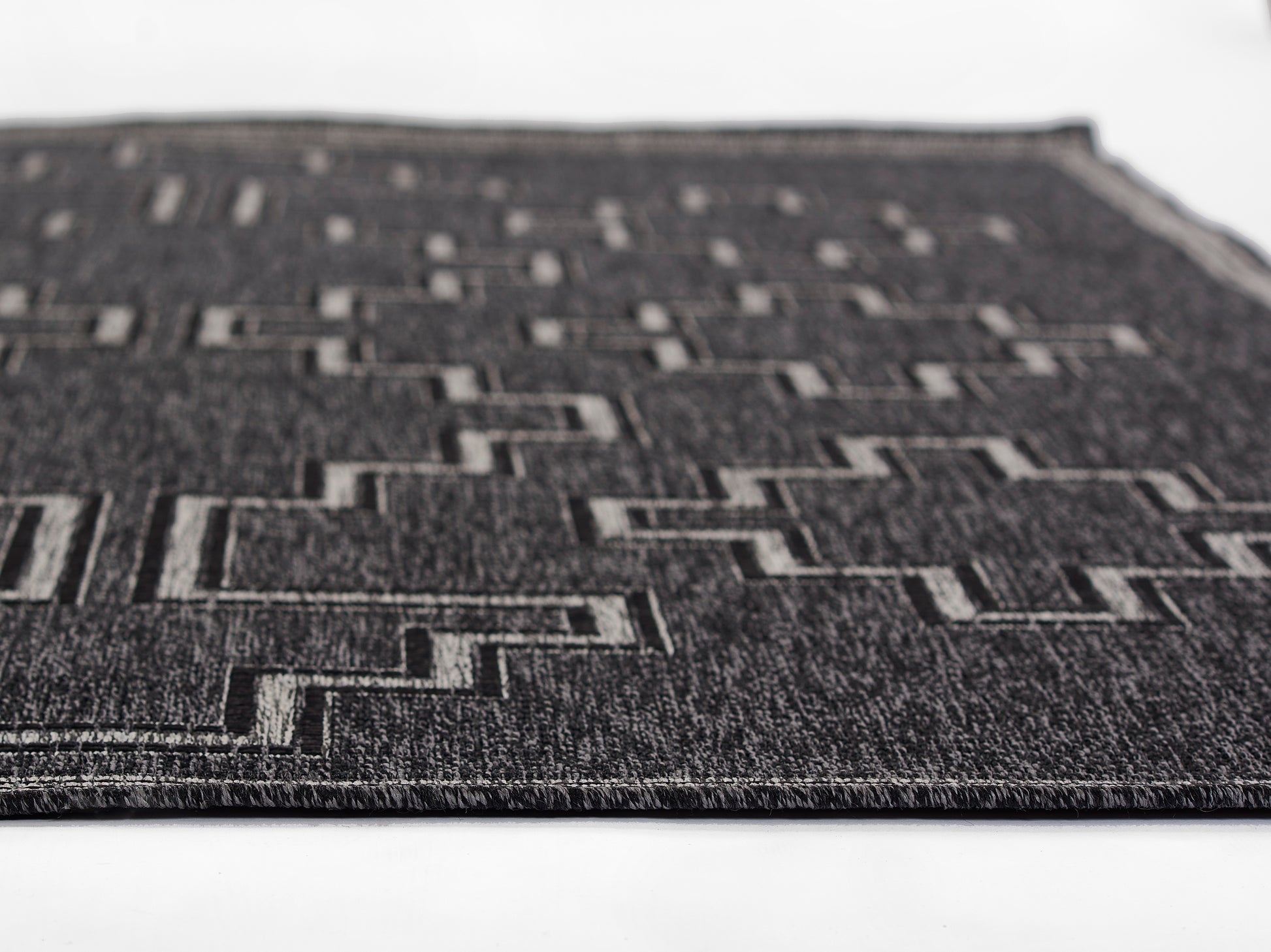 HAMPOHAM-9BLK black geometric rug with stepped rectangular pattern in light gray, flat-weave texture.