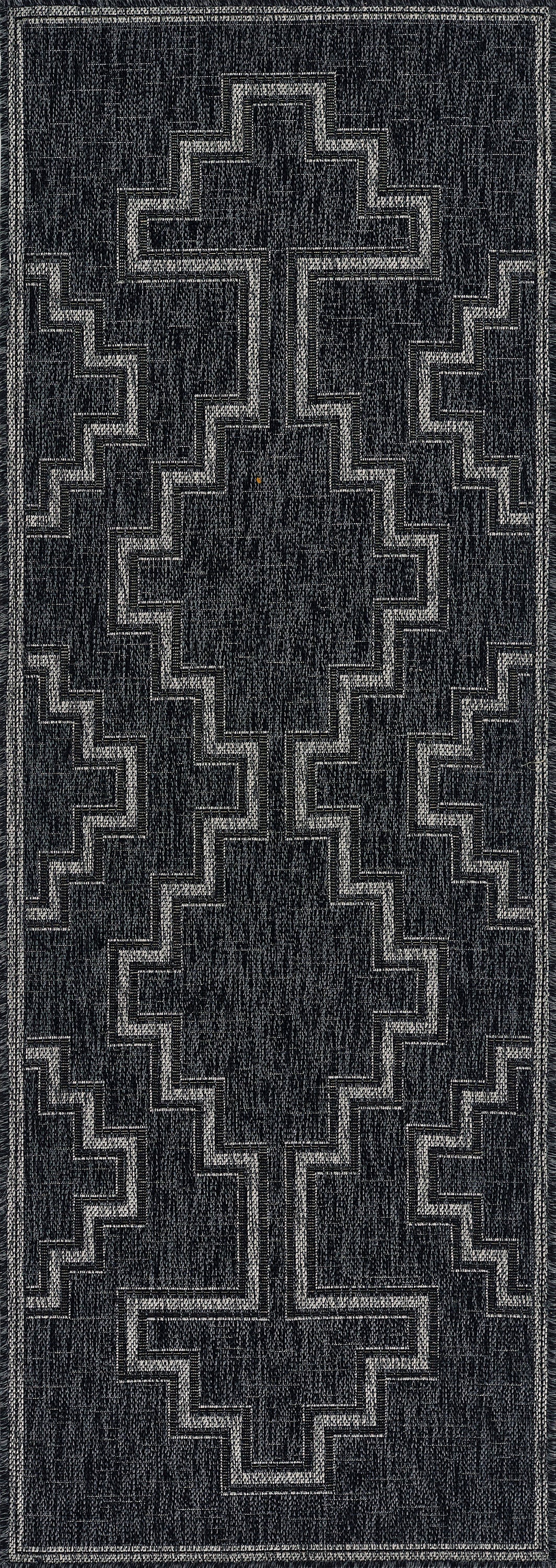 Charcoal gray rectangular rug runner with light gray stepped cross geometric pattern; modern tribal style.