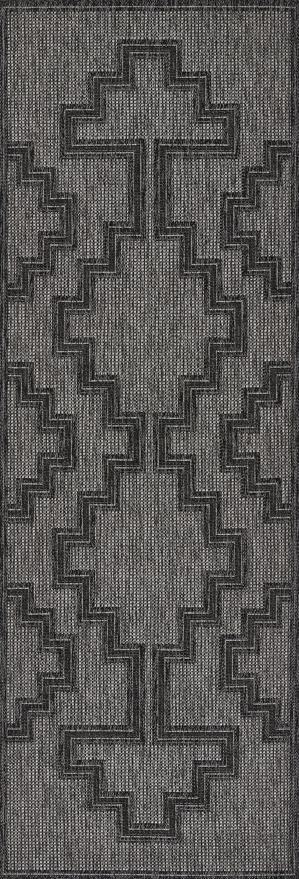 Dark gray woven rug featuring a large stepped cross motif with geometric borders in lighter gray threads.