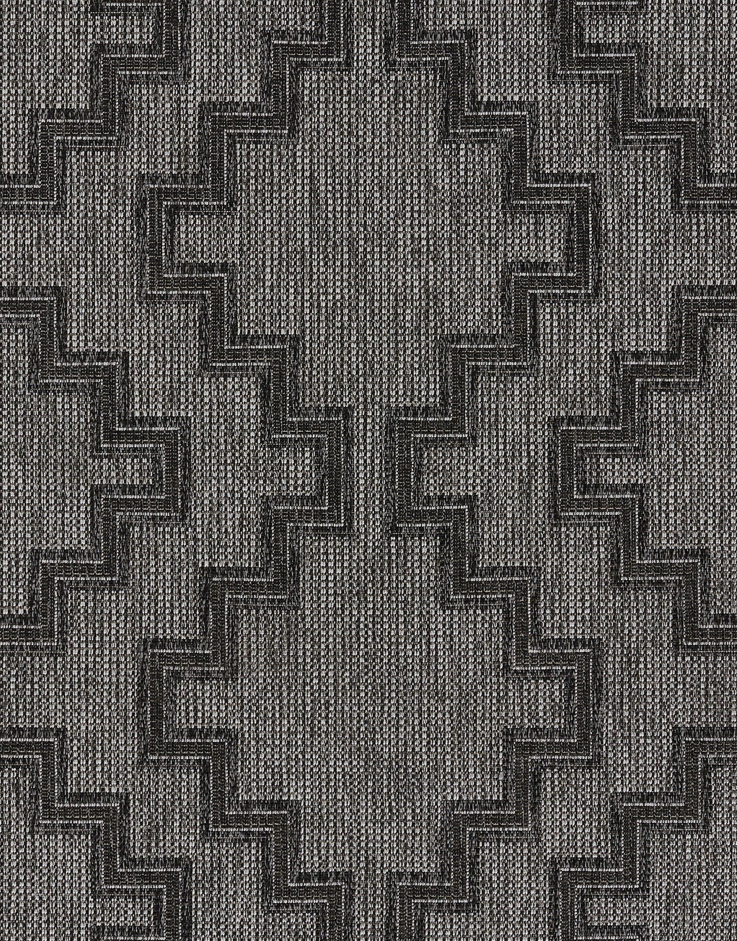 Gray woven rug with dark stepped zigzag chevron motif on textured background.