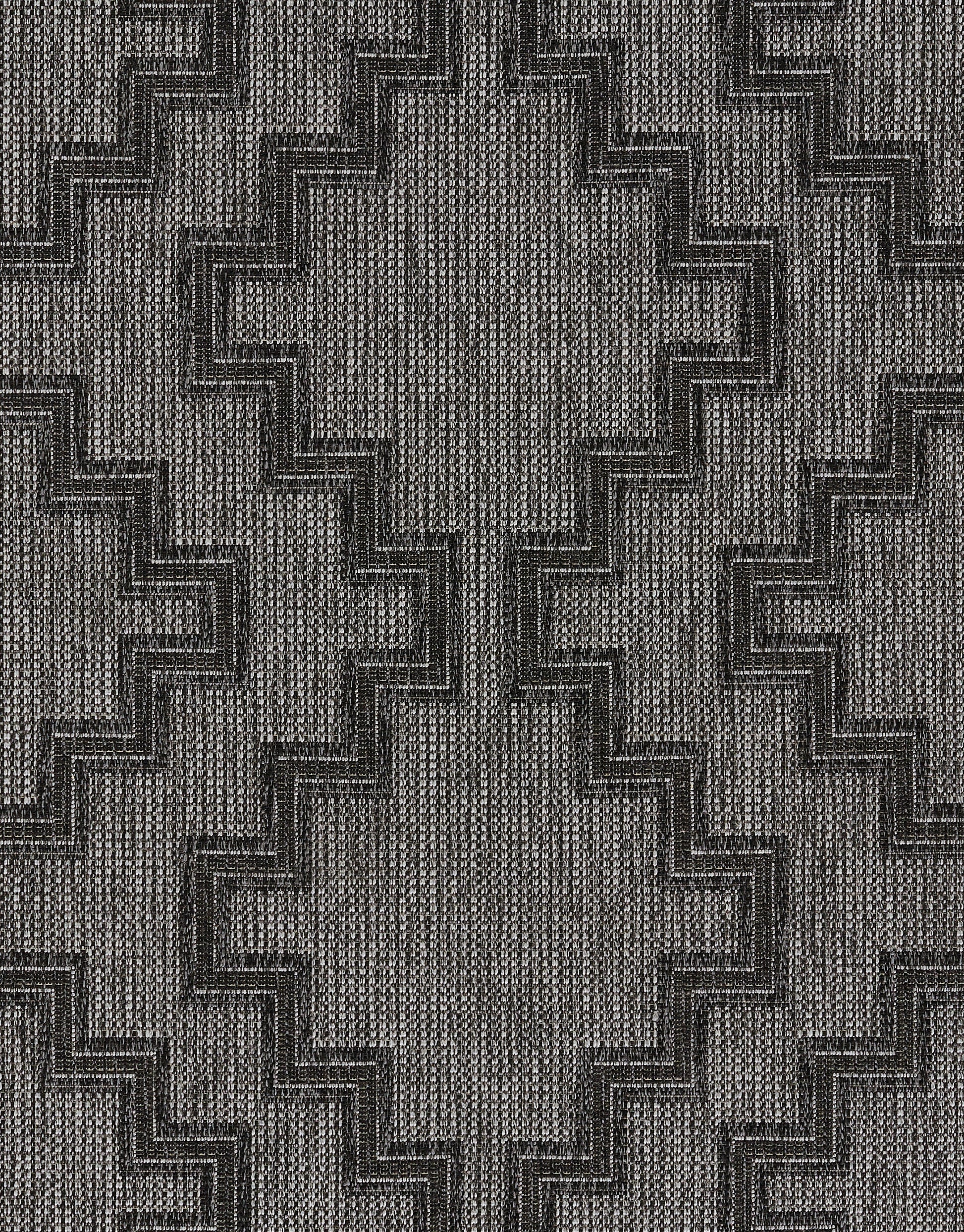 Gray woven rug with dark stepped zigzag chevron motif on textured background.