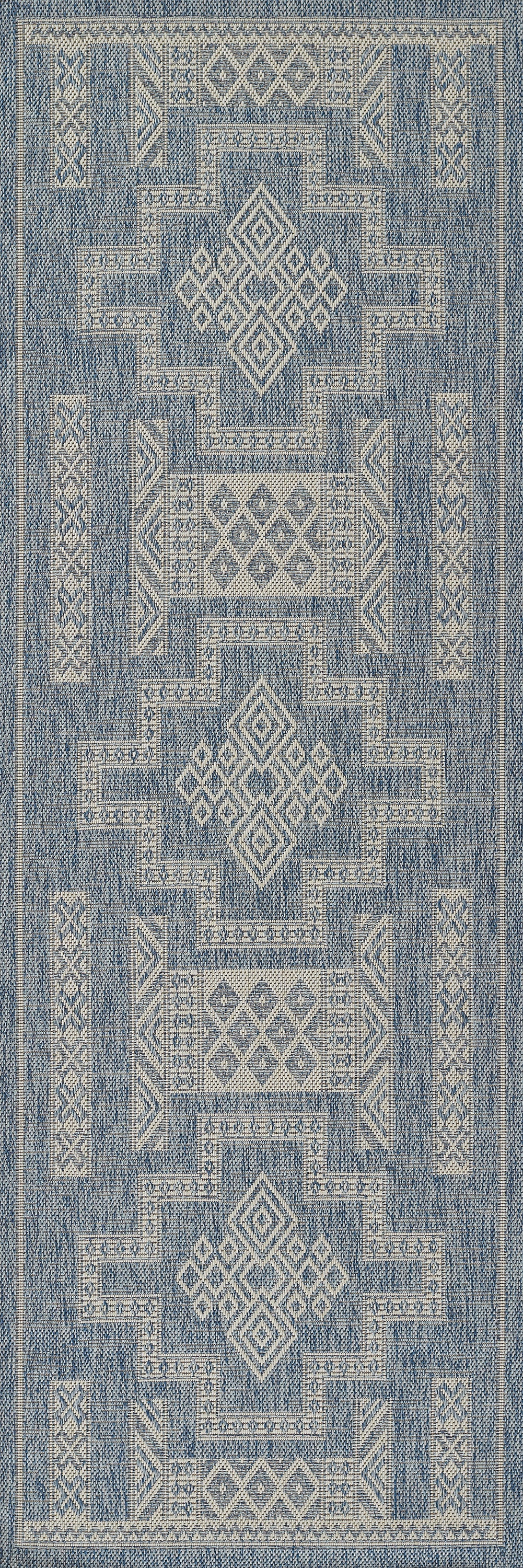 Blue and ivory geometric rug with diamond motifs and stepped borders; woven textile, rectangular indoor rug.