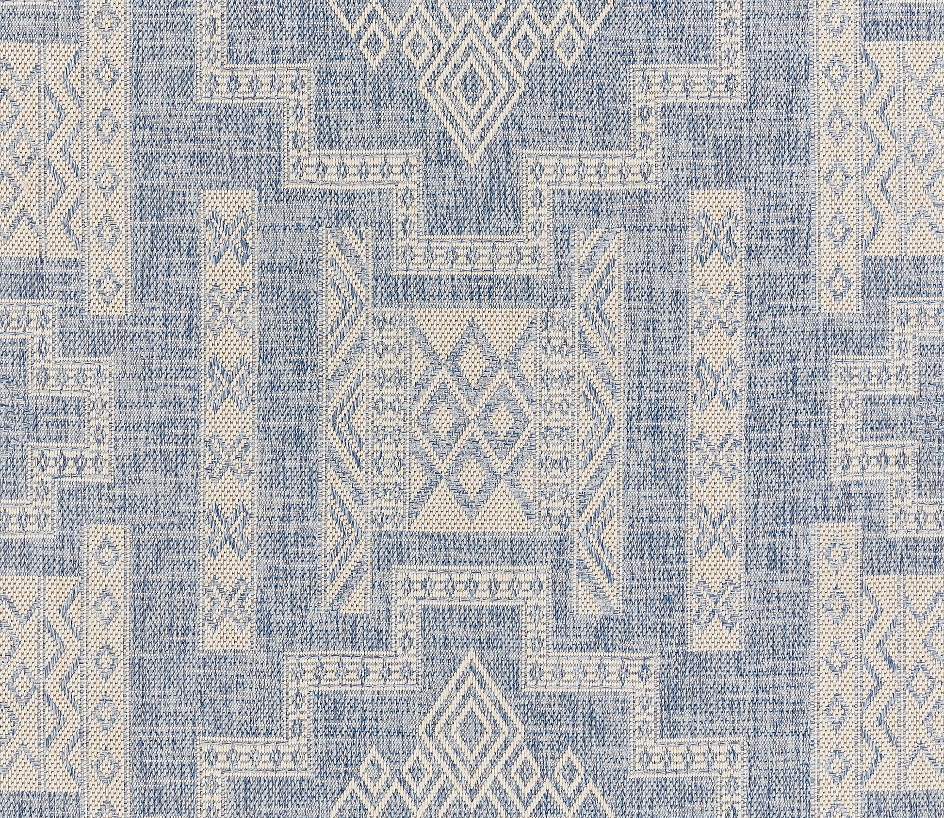 Blue & ivory geometric rug with diamond motifs & patchwork blocks, woven textile.