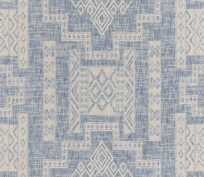 Blue and ivory geometric woven area rug with diamond and lattice motifs in a patchwork, tribal-inspired design.