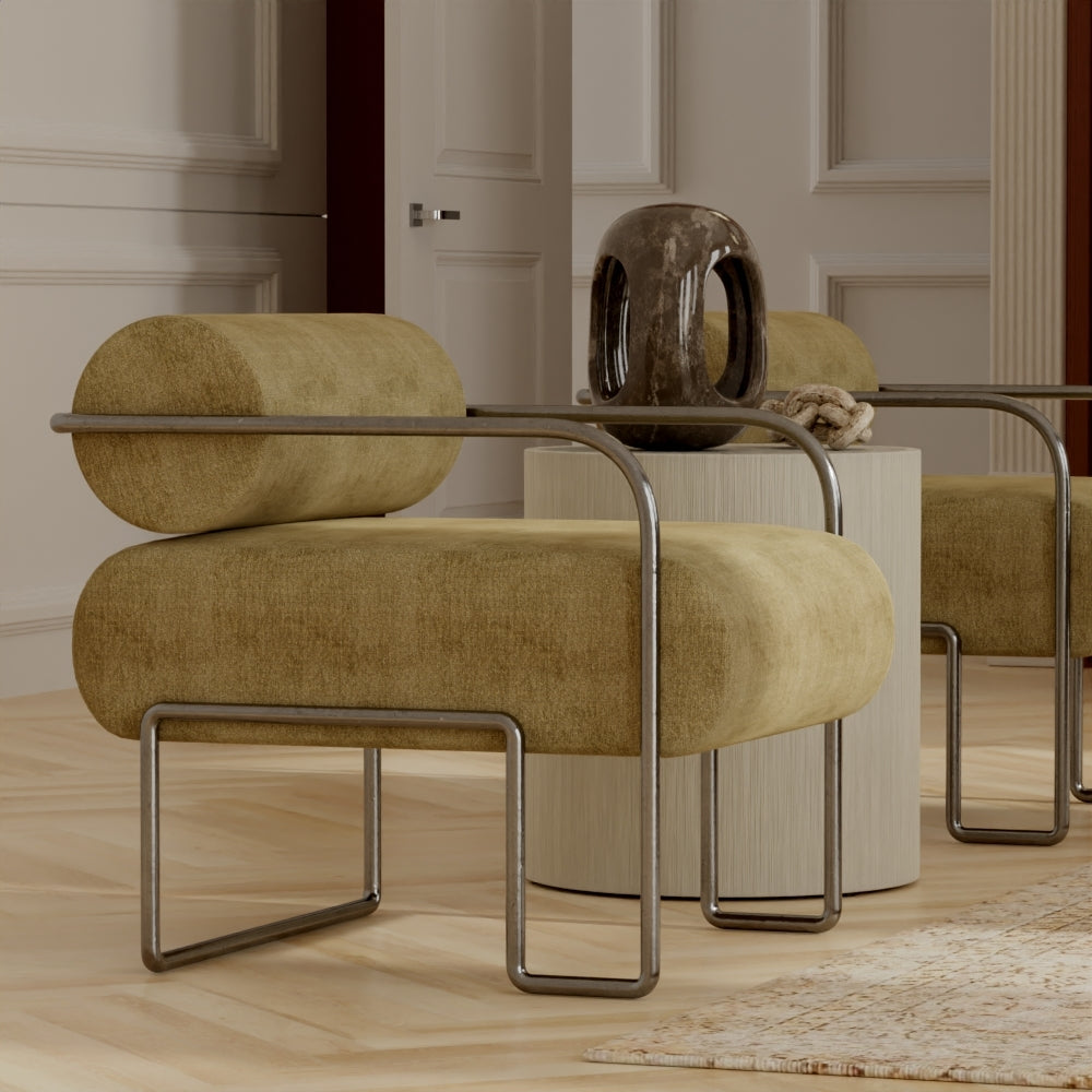Beige suede lounge chairs with chrome tubular frames and mustard cushions in a modern living room with wood floors.