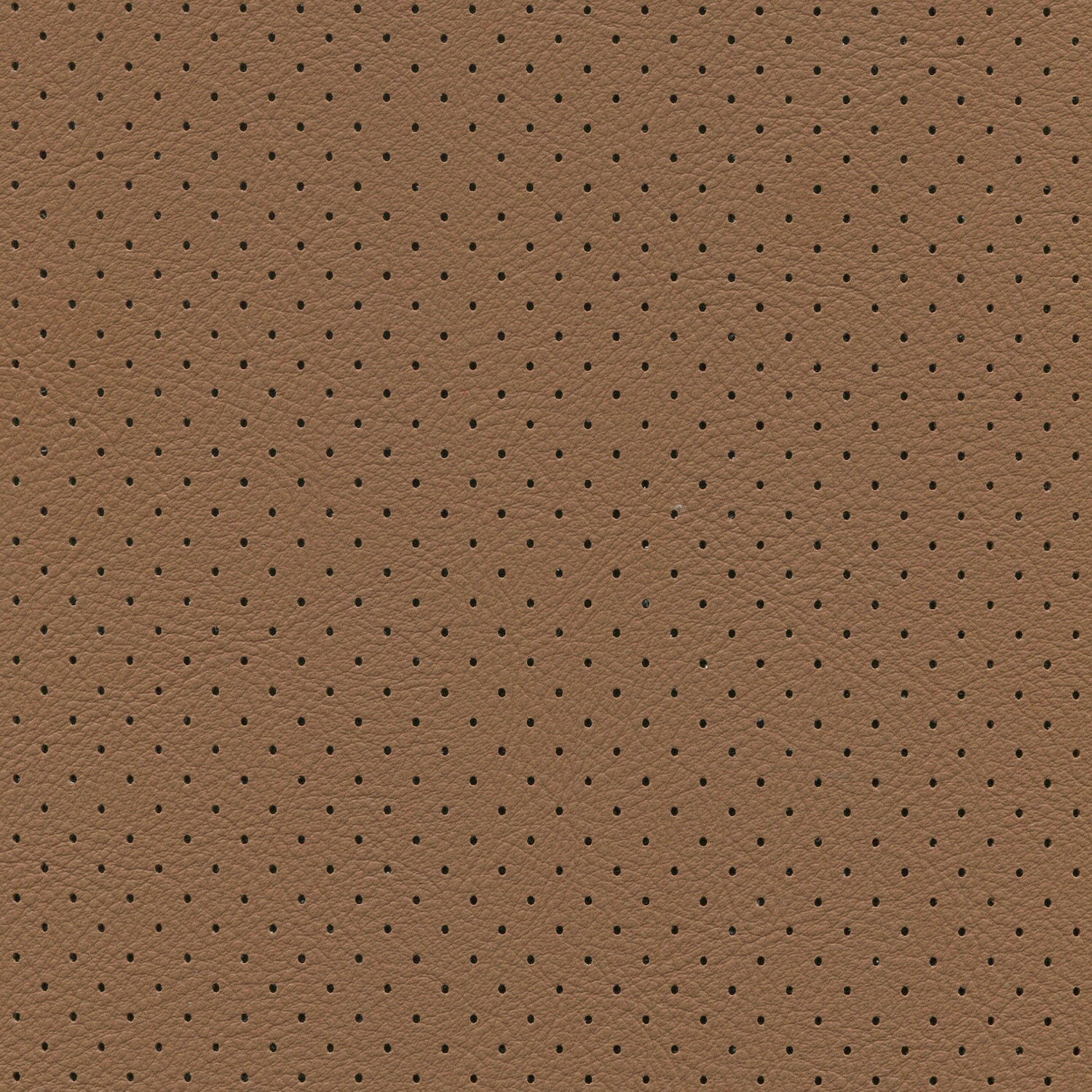Close-up of brown saddle fabric with evenly spaced tiny perforations.