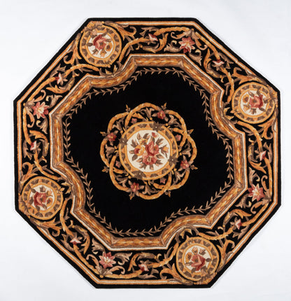 Octagonal black rug featuring gold, bronze and red floral embroidery, central medallion and ornate border.