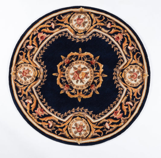 Rectangular navy rug with gold, cream, and red floral medallions and an intricate border.