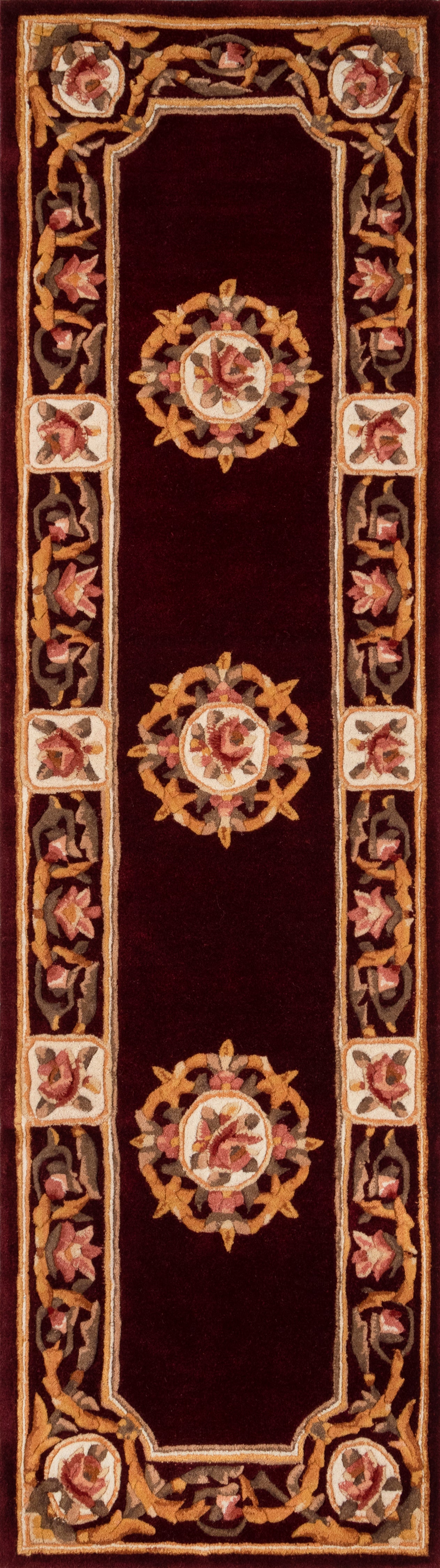 Narrow burgundy oriental rug runner with gold scrolling border and central floral medallions.