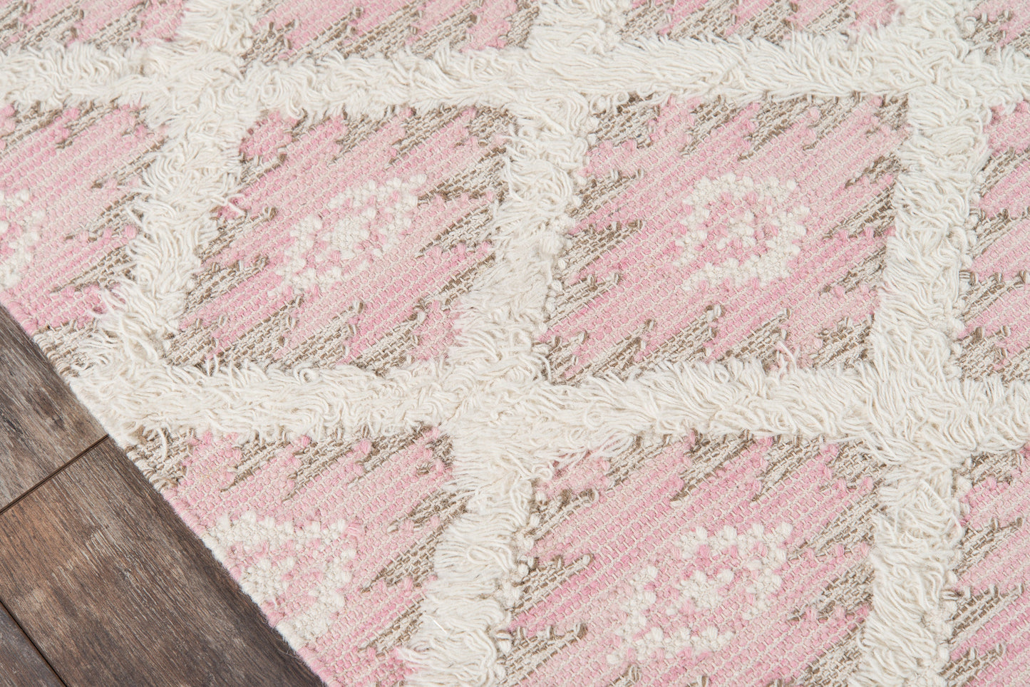 Soft pink and ivory geometric rug with beige accents and fluffy cream grid lines, plush tufted pile.