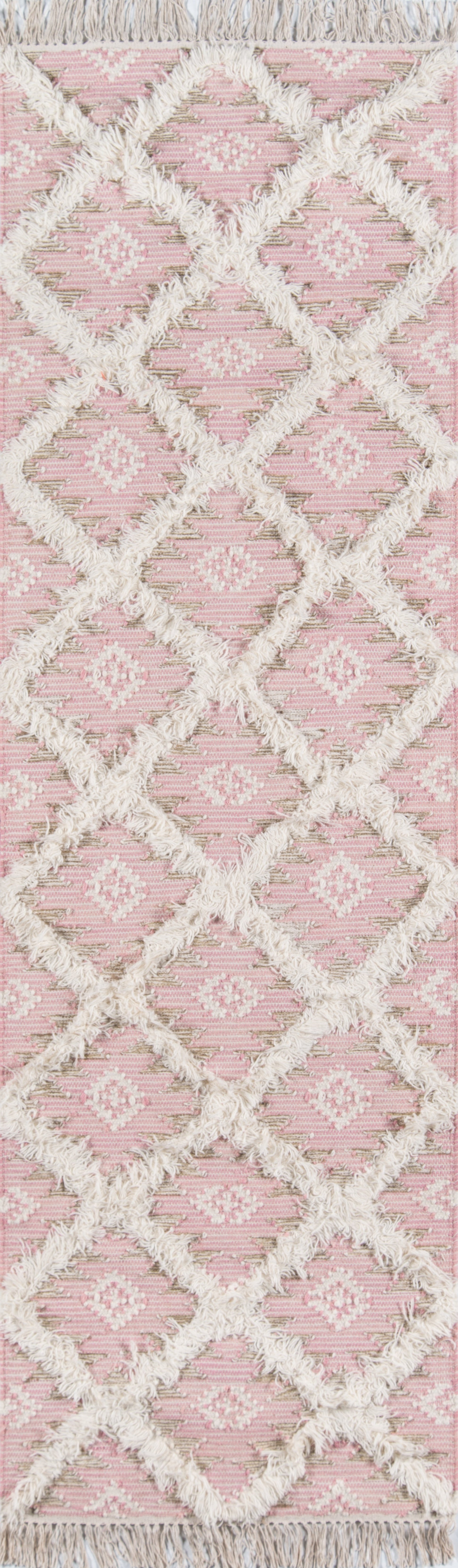 Pink rug with cream shaggy diamond lattice pattern and fringe edges.