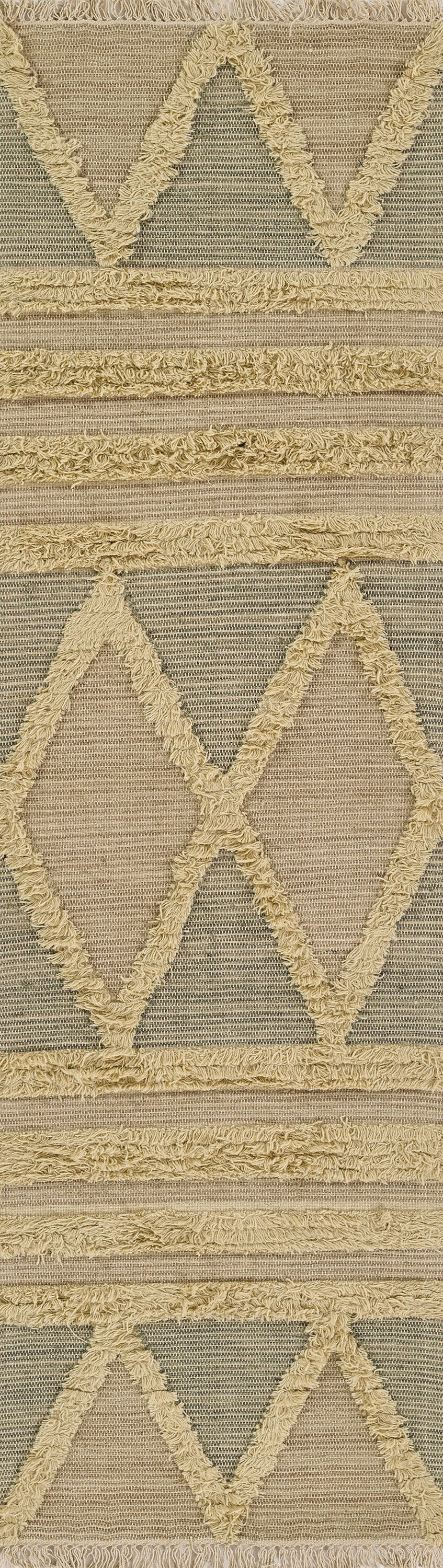 Beige geometric rug with large textured diamond motifs, cream shaggy fringe and taupe woven background.