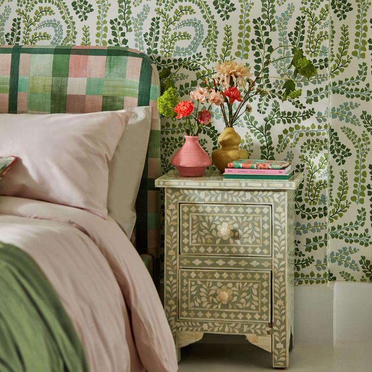 Harlequin Fayola Clover/Chalk wallpaper showing stylised leaves and tree-sprig motifs in soft clover and chalk tones for a refined botanical accent wall.