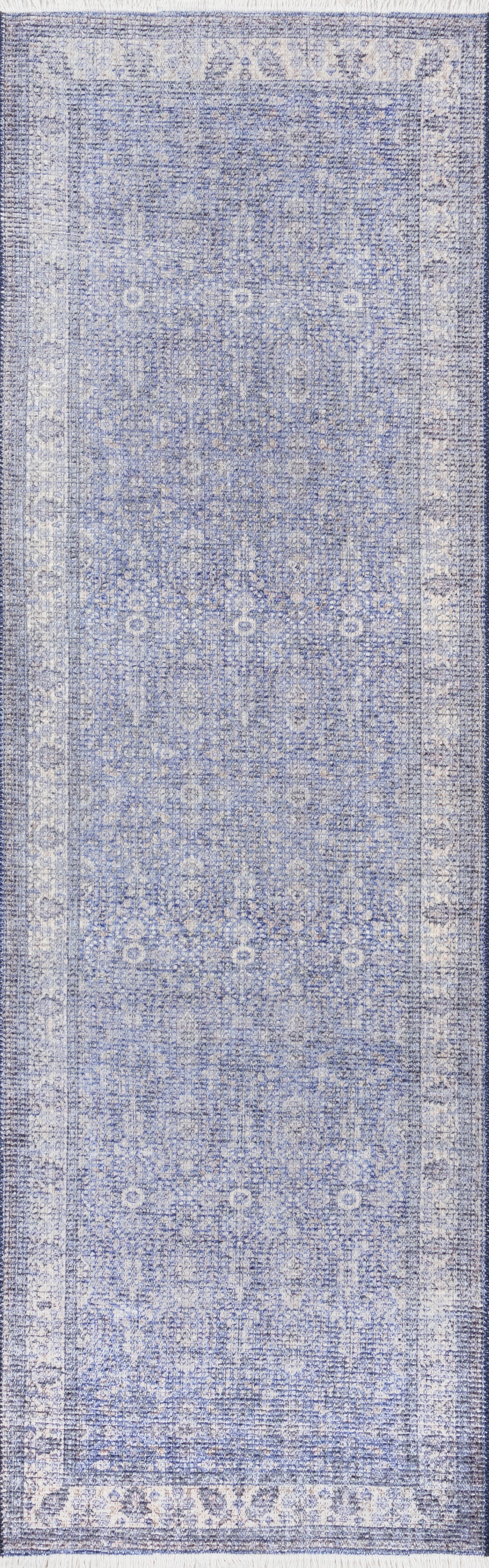 Blue distressed oriental runner rug with ivory floral medallions and an ornate border.