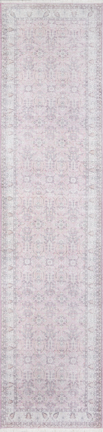 Soft pink distressed runner rug with a muted gray floral medallion pattern.