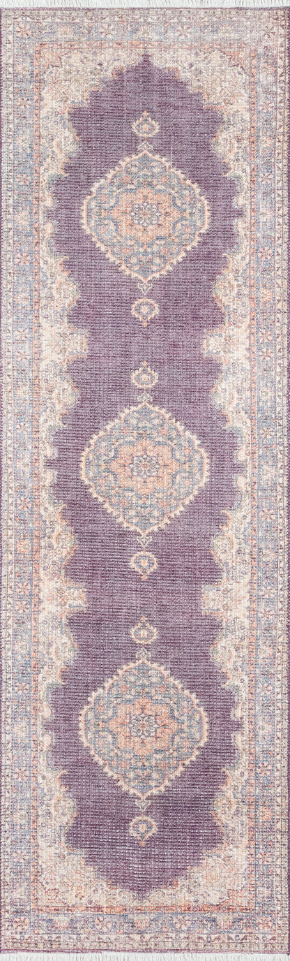 Persian-inspired runner rug with purple field, blue and peach medallion motifs, and pale beige border.