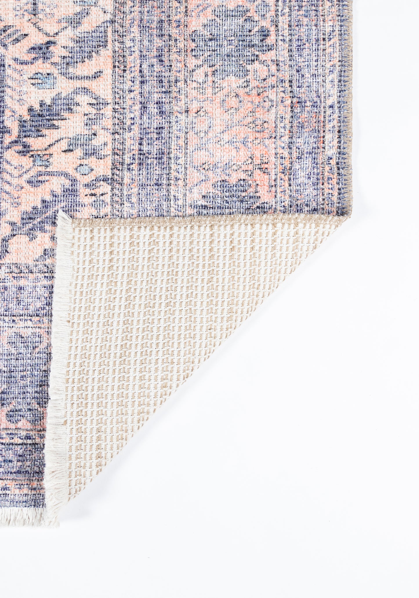 Persian-inspired rectangular runner rug in pink and blue floral print; woven pile with beige backing exposed.