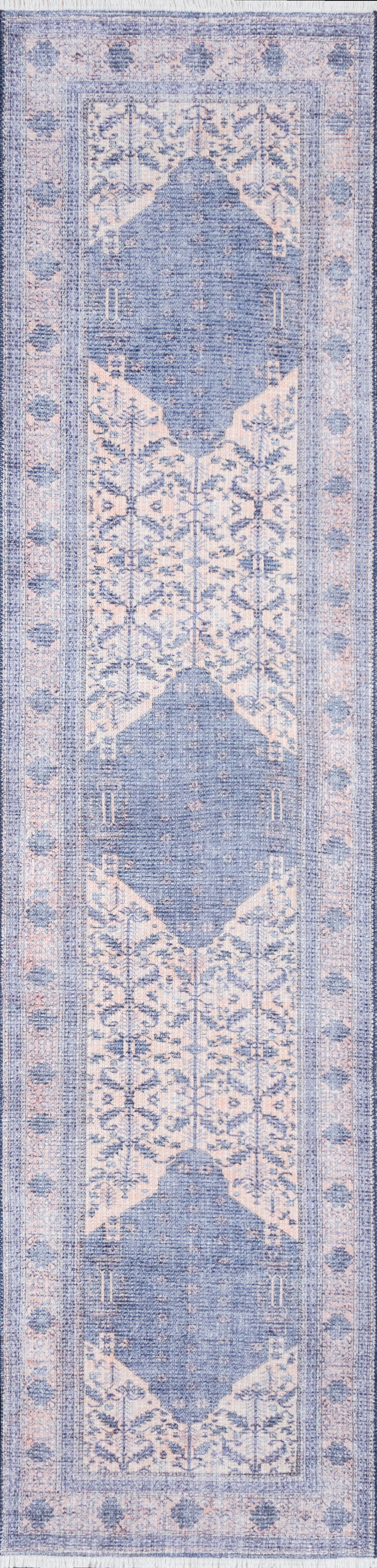 Distressed blue and blush pink oriental runner rug featuring repeating medallions and floral border.