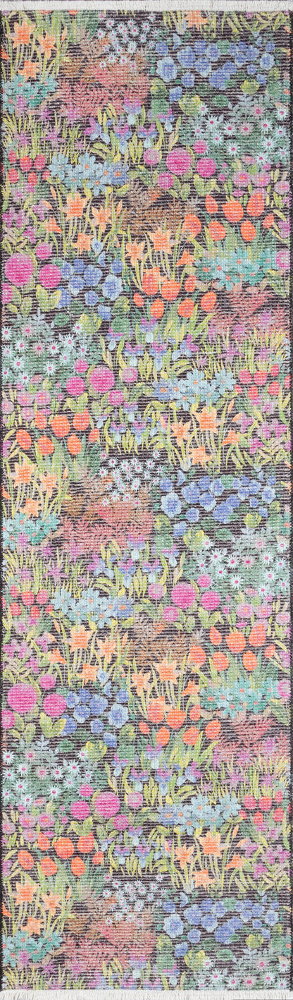 Long floral garden runner rug in tapestry weave with vibrant orange, pink, blue and purple flowers and green stems.