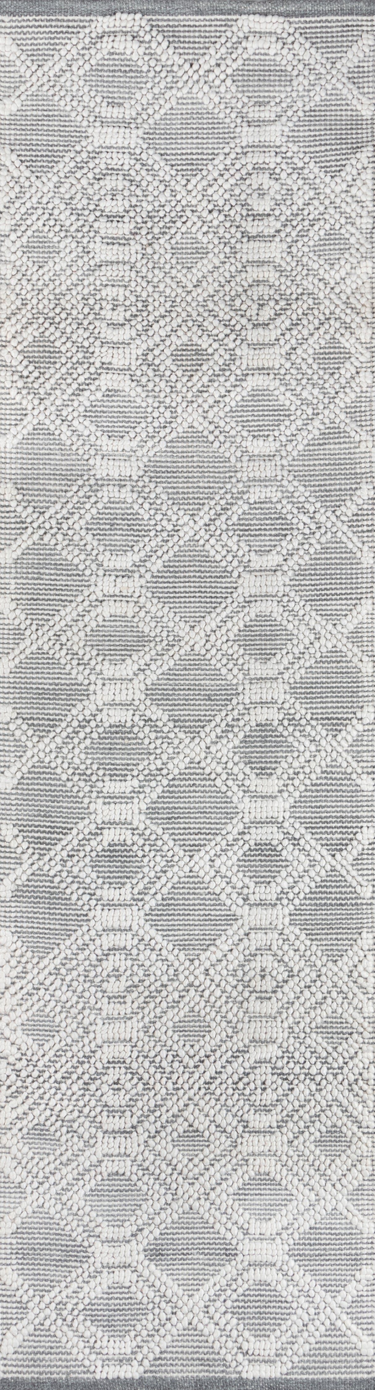 Gray rug with white beaded raised diamond lattice pattern; textured contemporary accent.