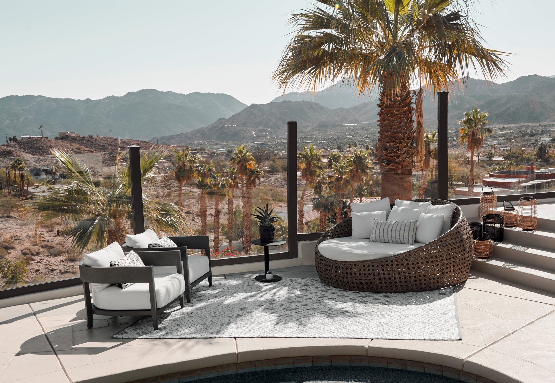 Gray 8' x 10' rug with a desert mountain view in the background.