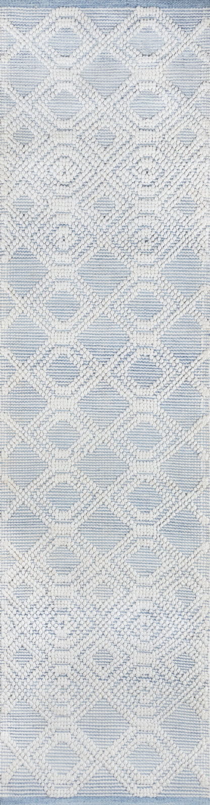 White beaded lattice pattern over light blue striped fabric; diamond and circular motifs, textured and elegant.