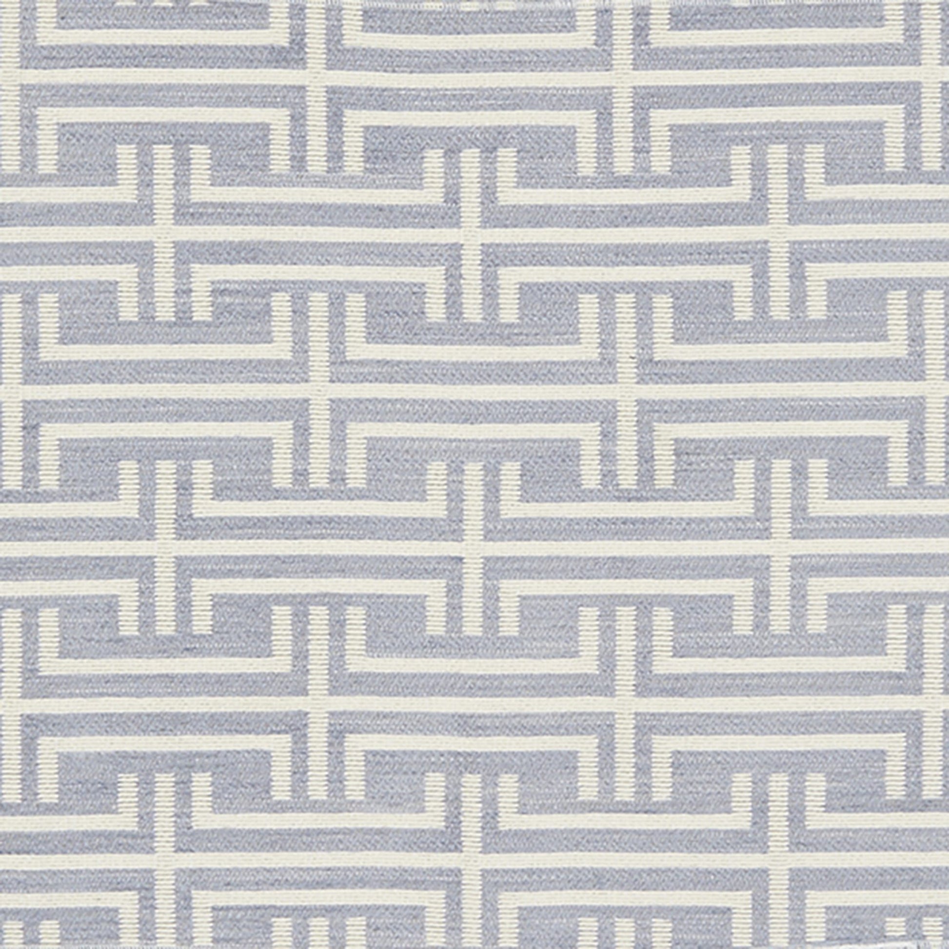 Ivory Greek-key maze pattern on a blue-gray background; repeating geometric border motif suitable for fabric or wallpaper.