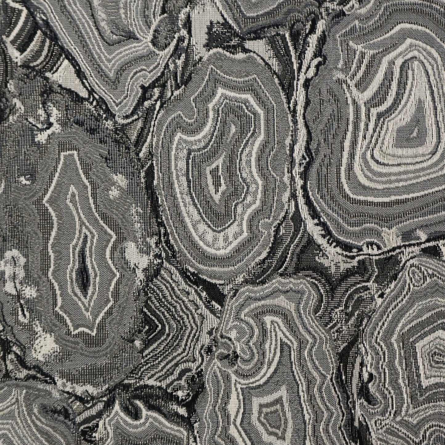 Gray and black geode-patterned jacquard fabric; textured woven textile for upholstery