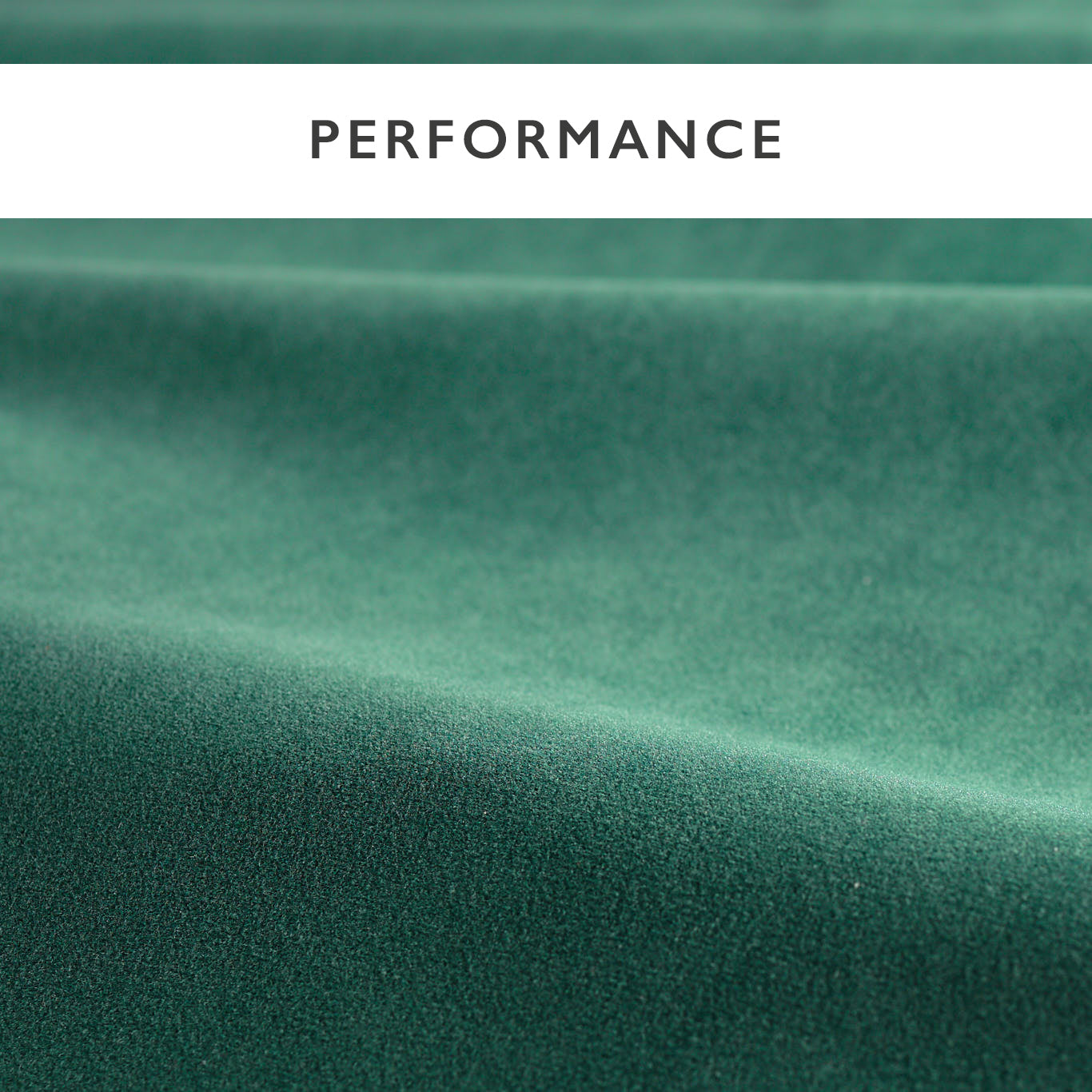 Emerald green velvet fabric close-up with soft nap & flowing folds; white PERFORMANCE banner at the top.