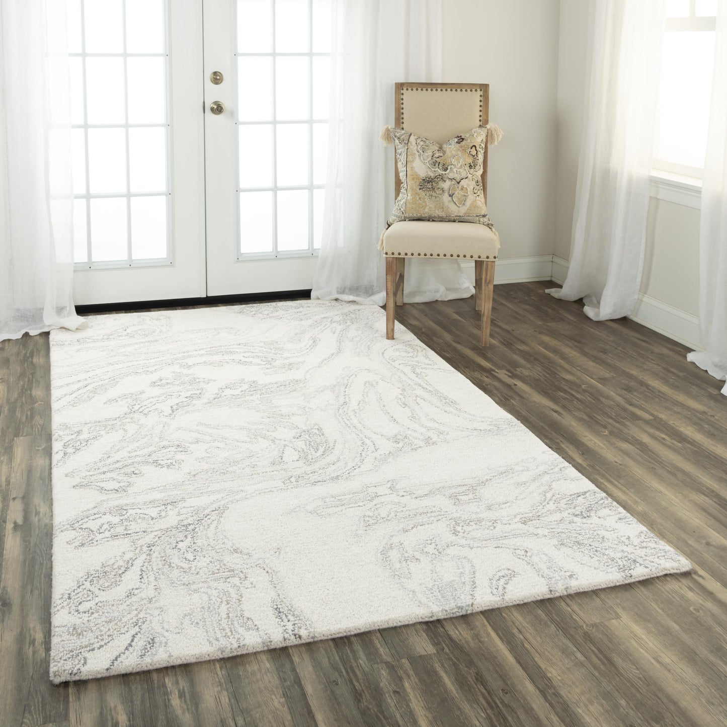 Contemporary area rug, 5' x 8', with a neutral-toned pattern.