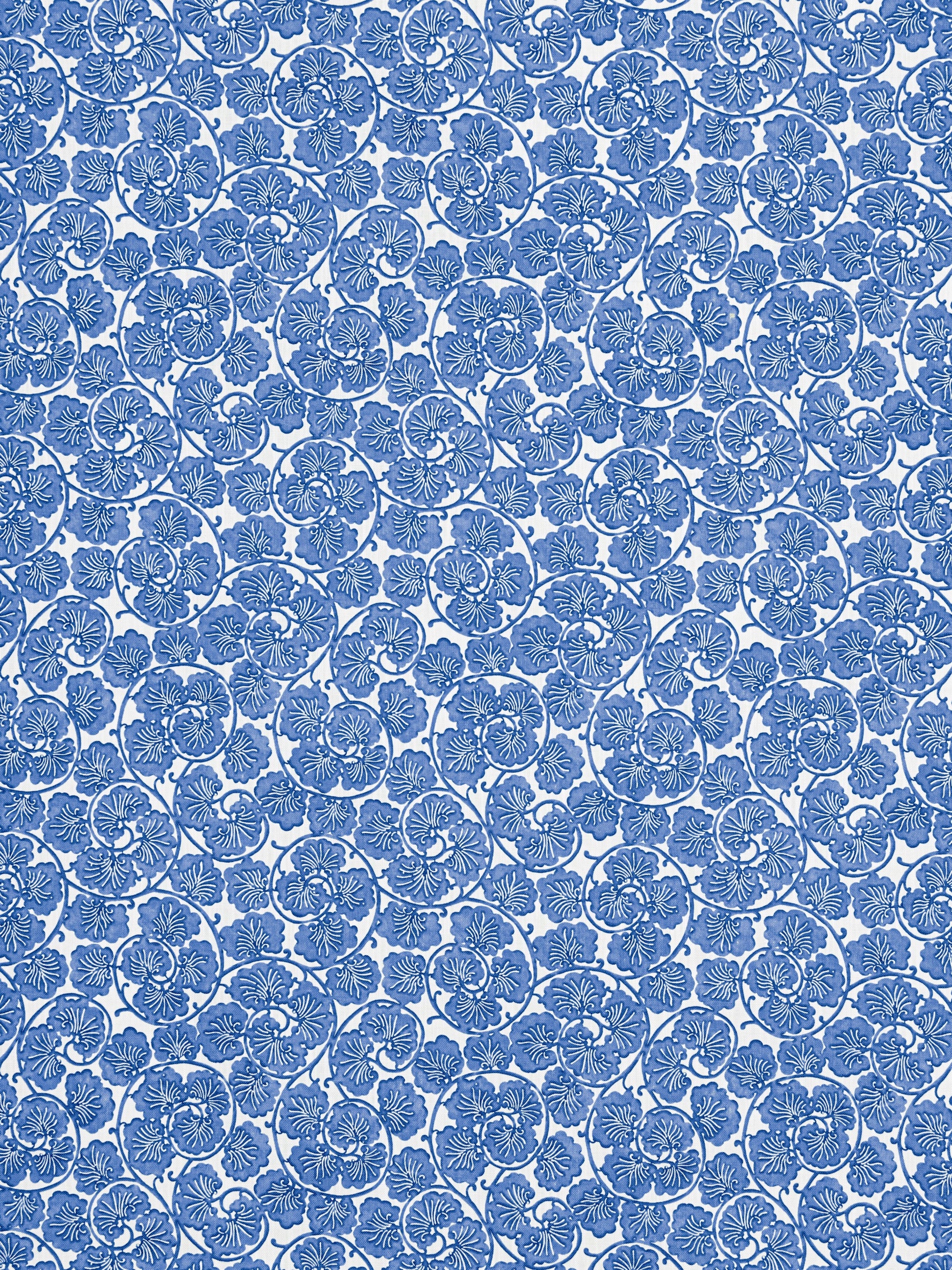 Blue damask floral fabric with repeating rosette motifs; intricate, elegant textile for upholstery or apparel.