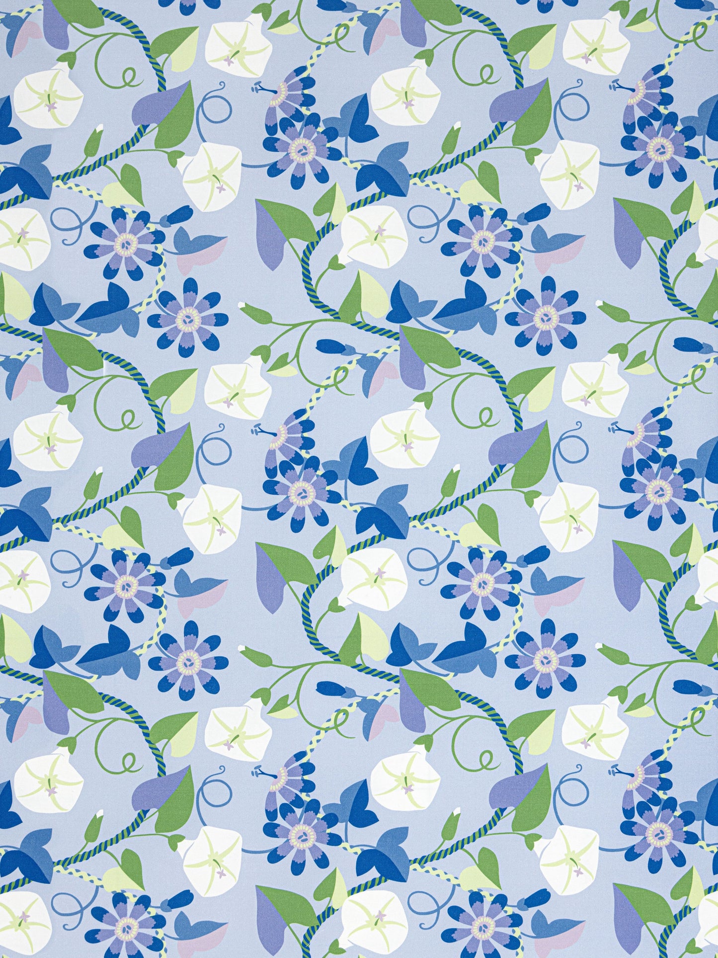 Floral pattern with blue, lavender and white flowers, green leaves and twisting vines on a light blue background.