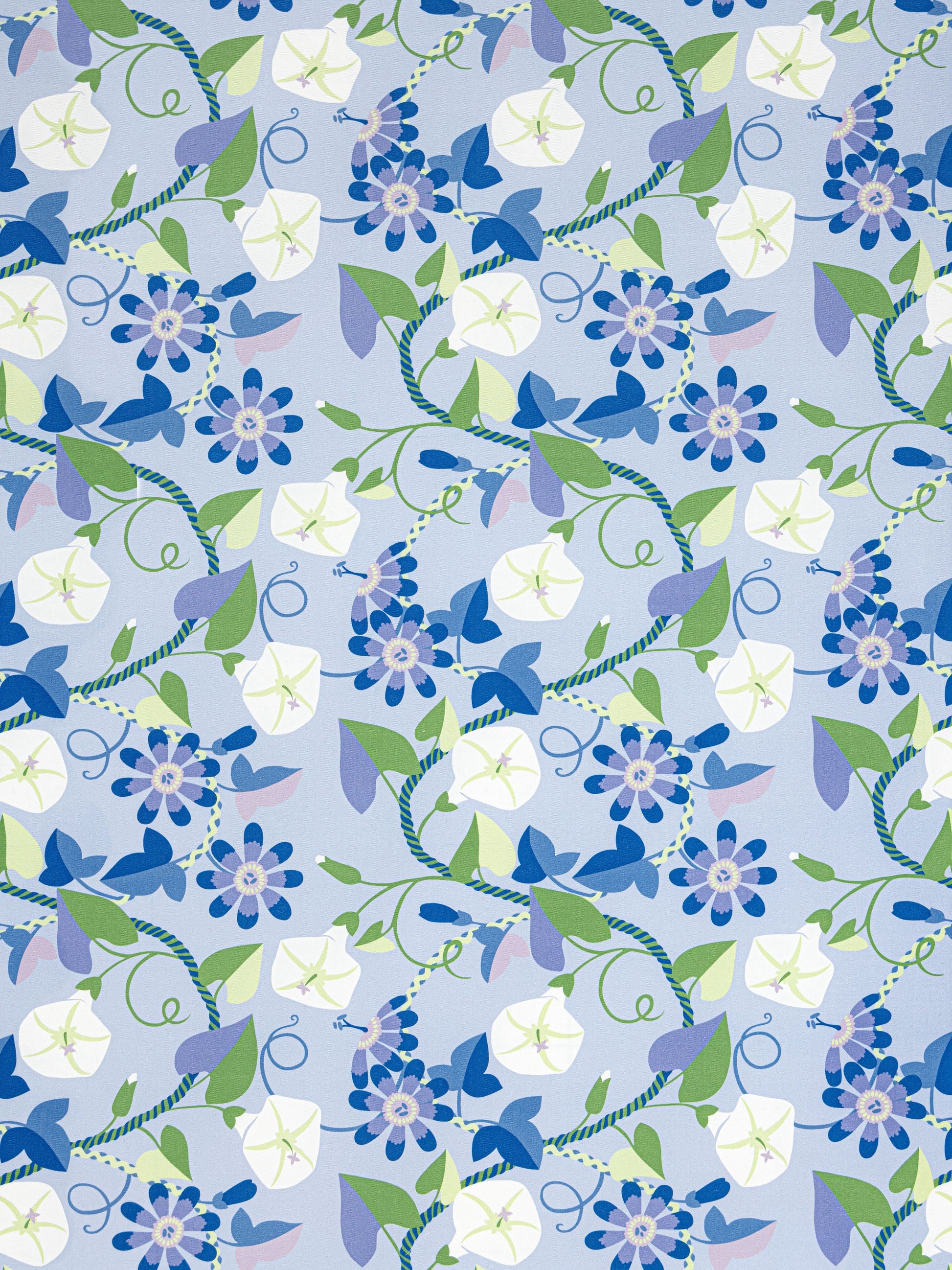 Floral pattern with blue, lavender and white flowers, green leaves and twisting vines on a light blue background.