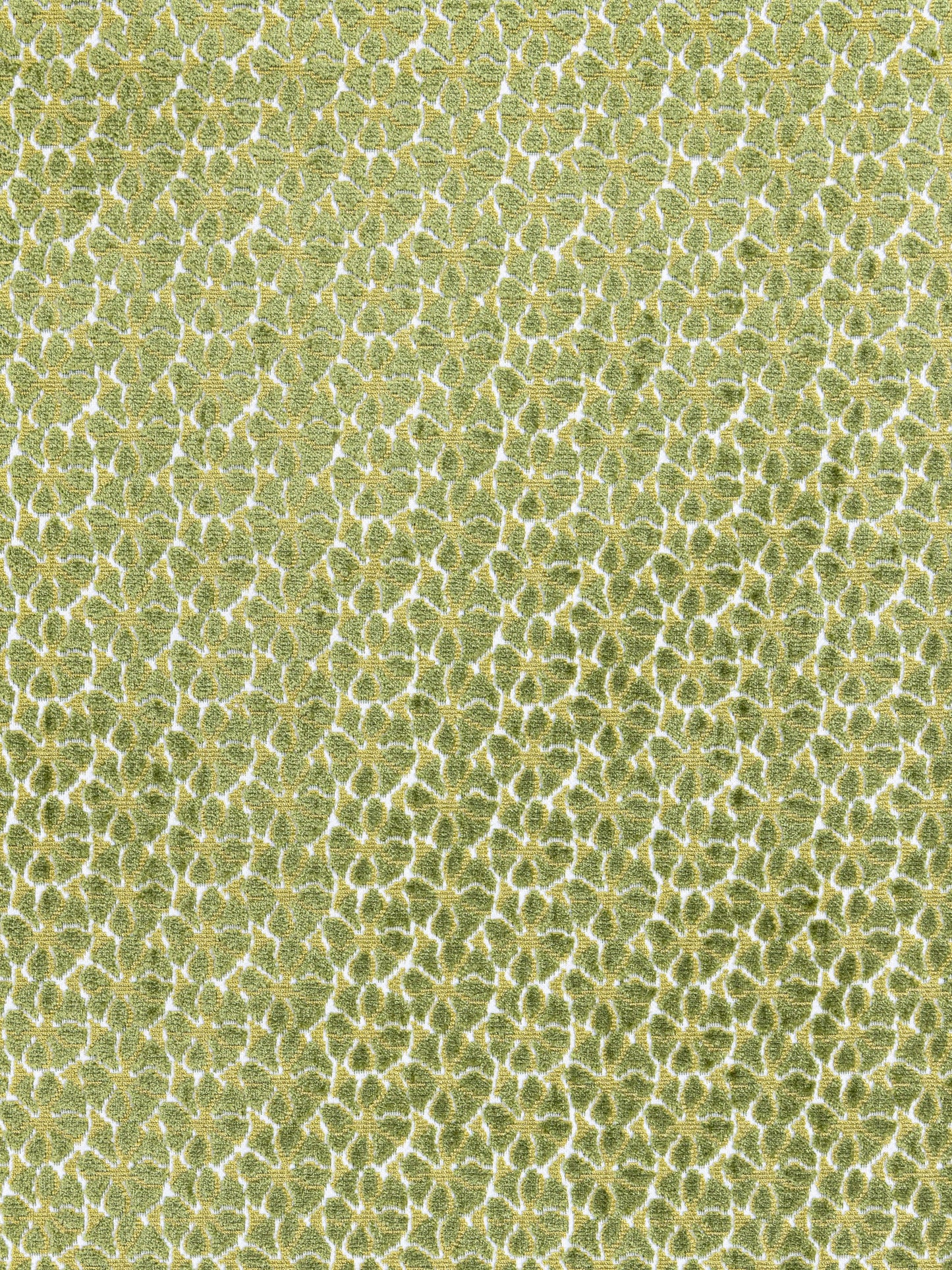 Lime-green textured fabric with a repeating white-edged scale/honeycomb pattern for upholstery or decor.