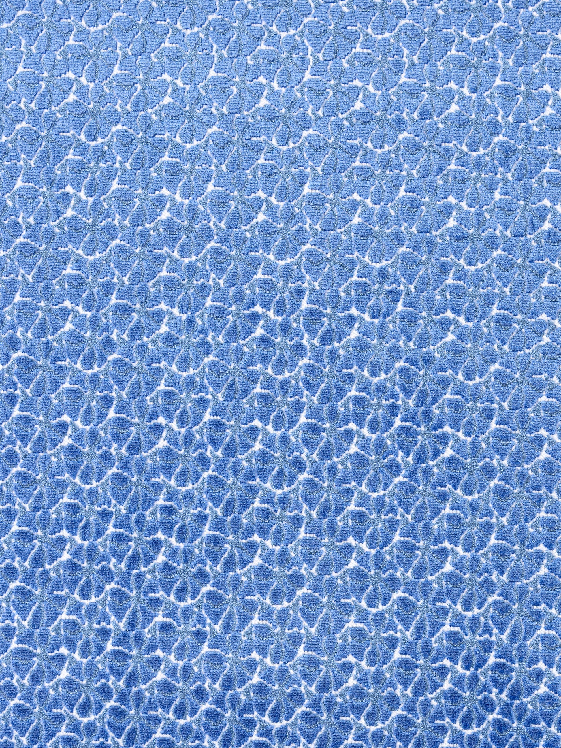 Blue crackle texture with white vein-like lines, fabric or wallpaper pattern.
