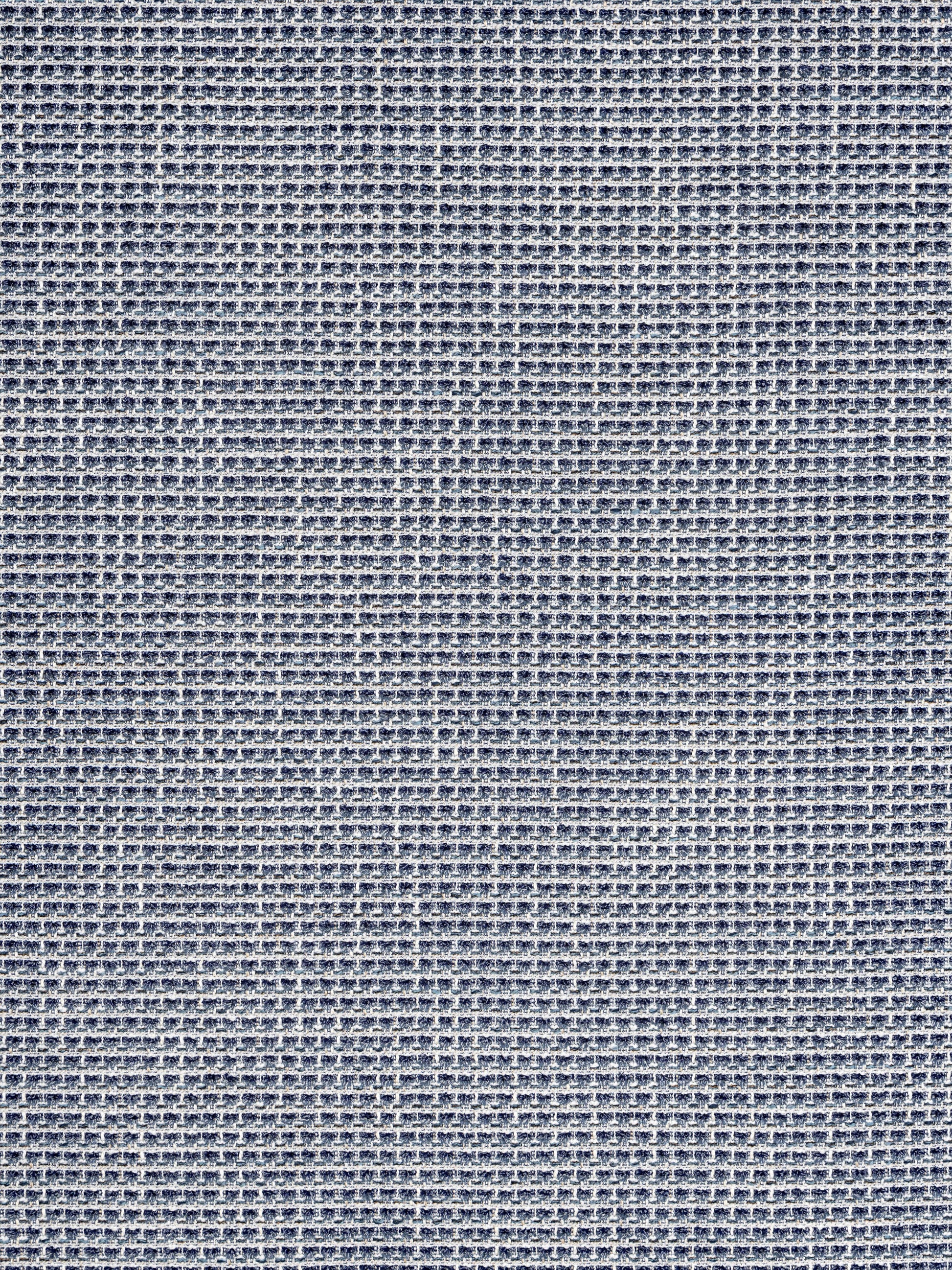 Close-up of blue woven fabric with a tiny grid texture, denim-inspired textile.