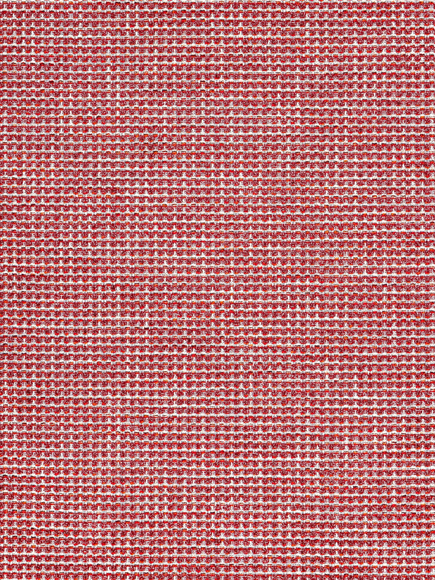 Red woven fabric with a dense micro-pattern of white specks; textured textile suitable for upholstery or apparel.