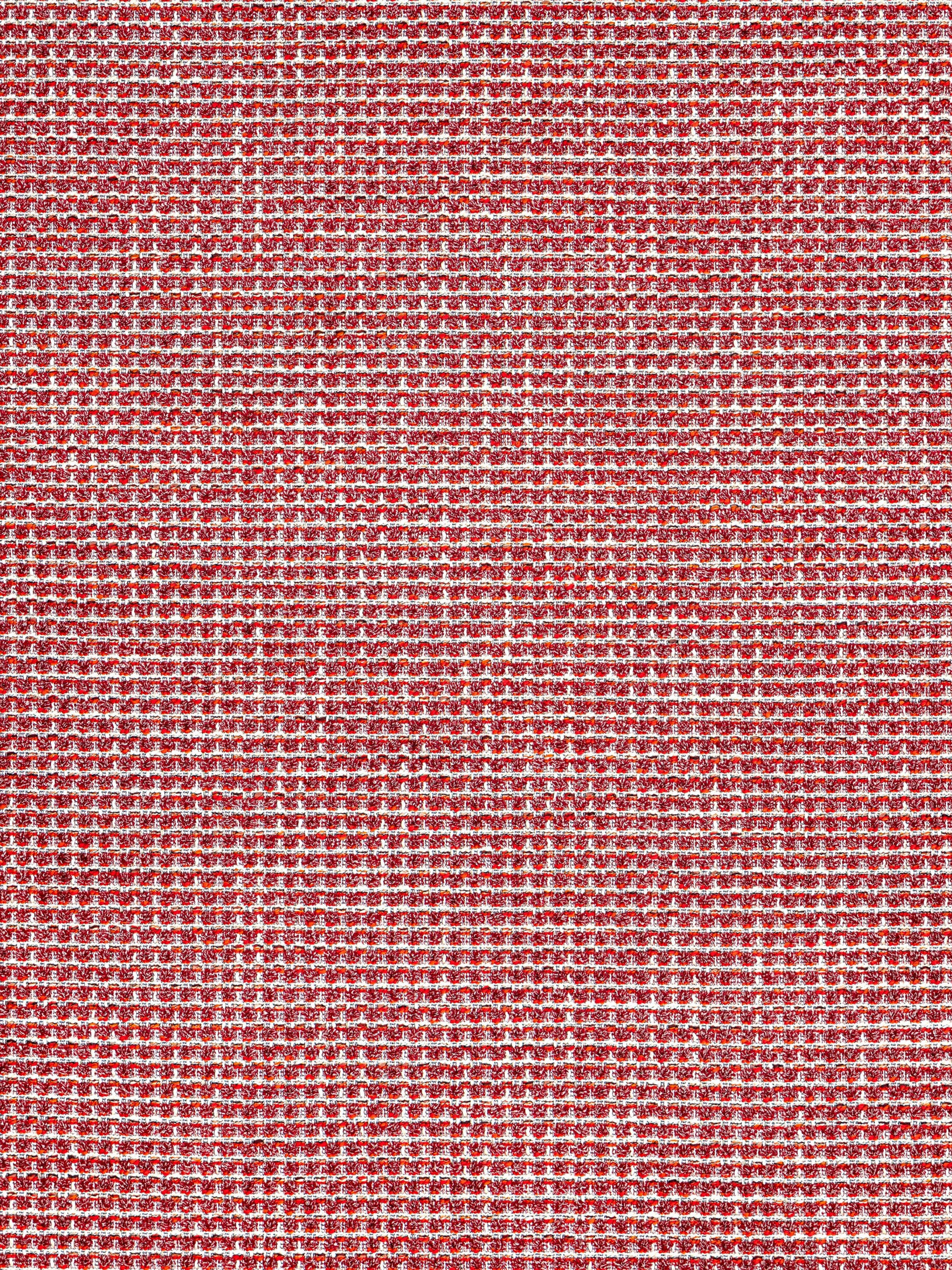 Red woven fabric with a dense micro-pattern of white specks; textured textile suitable for upholstery or apparel.